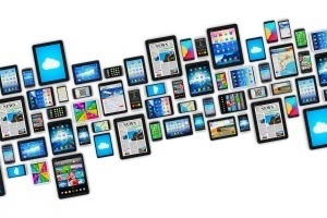 Group of tablet computer PC and modern touchscreen smartphones or mobile phones with colorful display screen interfaces with icons and buttons isolated on white background